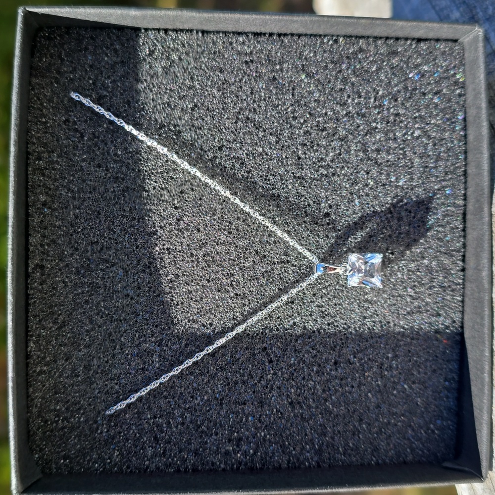 5XHP. NIB. Rhodium Over Sterling Silver Chain Lab Created White Sapphire Pendant